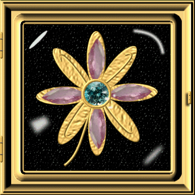 Gold Frame Glass Topped Box with a gold flower embellished with jewels.